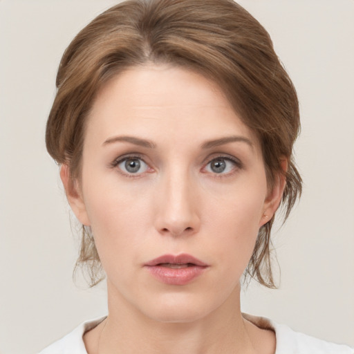 Neutral white young-adult female with medium  brown hair and grey eyes