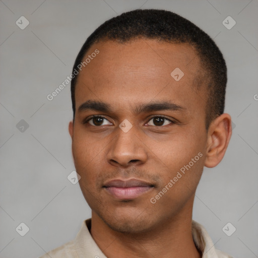 Joyful latino young-adult male with short  brown hair and brown eyes