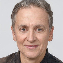 Joyful white middle-aged male with short  brown hair and brown eyes