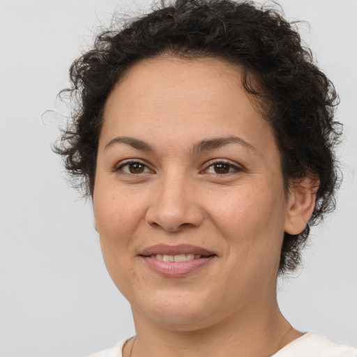 Joyful white adult female with short  brown hair and brown eyes