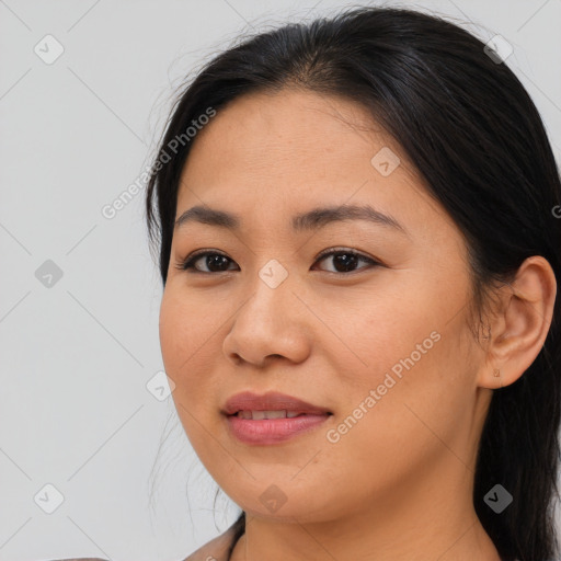 Joyful asian young-adult female with medium  brown hair and brown eyes