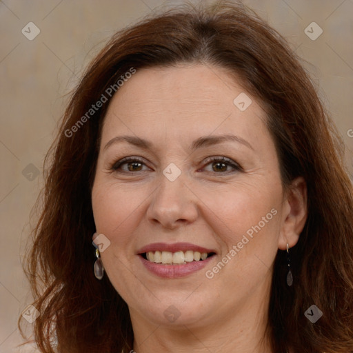 Joyful white adult female with long  brown hair and brown eyes