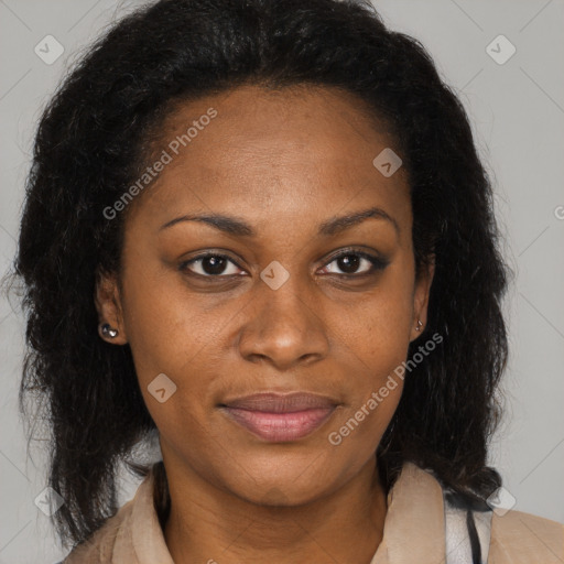 Joyful black adult female with medium  brown hair and brown eyes