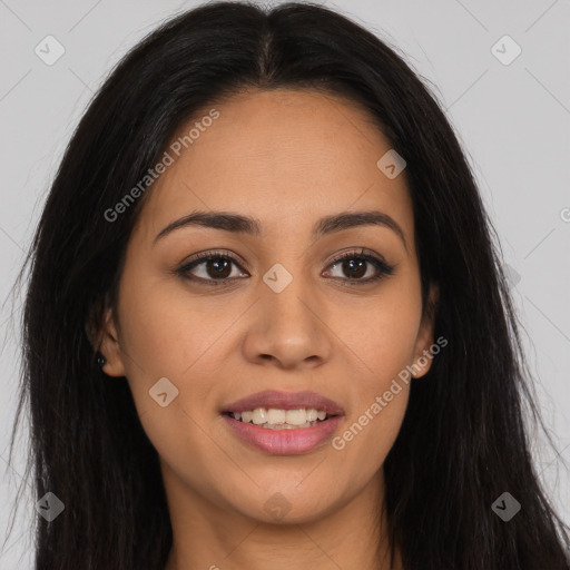 Joyful latino young-adult female with long  brown hair and brown eyes