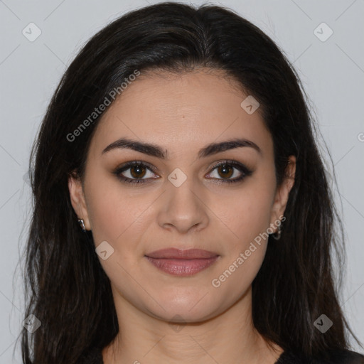 Joyful latino young-adult female with long  brown hair and brown eyes