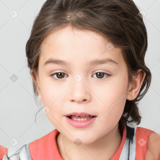 Joyful white child female with medium  brown hair and brown eyes