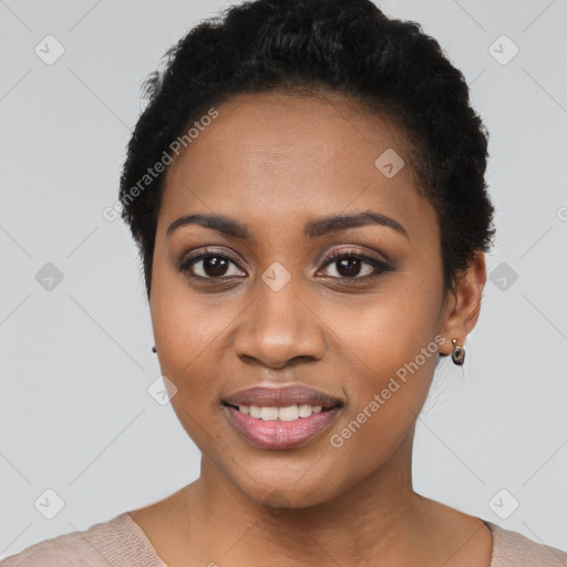 Joyful black young-adult female with short  black hair and brown eyes