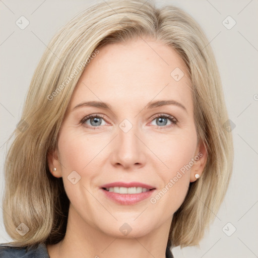 Joyful white young-adult female with medium  brown hair and blue eyes