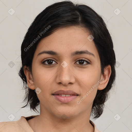 Joyful latino young-adult female with medium  brown hair and brown eyes