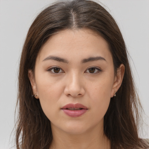 Neutral white young-adult female with long  brown hair and brown eyes