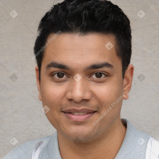 Joyful white young-adult male with short  black hair and brown eyes