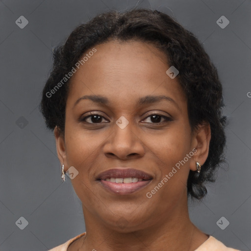 Joyful black adult female with short  brown hair and brown eyes