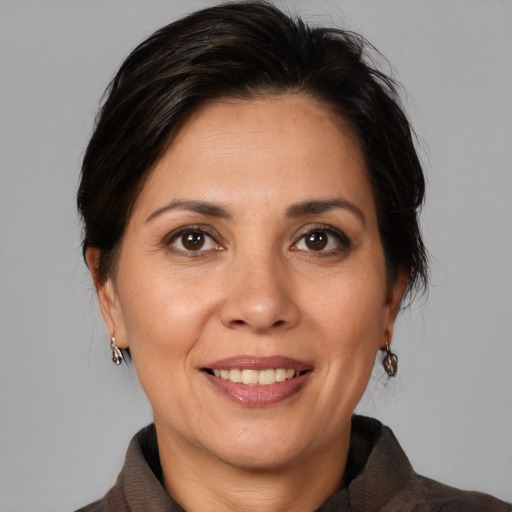 Joyful white adult female with medium  brown hair and brown eyes