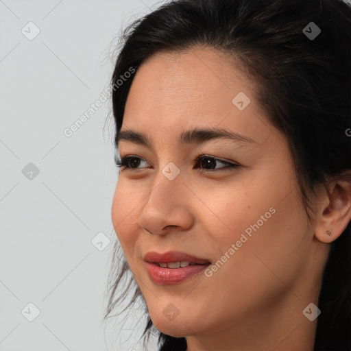 Joyful asian young-adult female with medium  brown hair and brown eyes