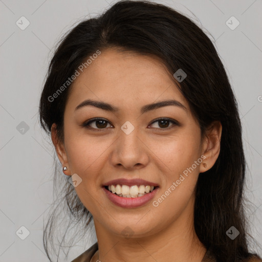 Joyful latino young-adult female with long  brown hair and brown eyes