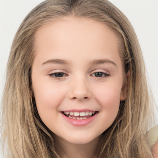 Joyful white child female with long  brown hair and brown eyes