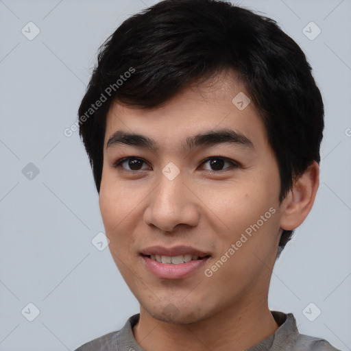 Joyful asian young-adult male with short  black hair and brown eyes