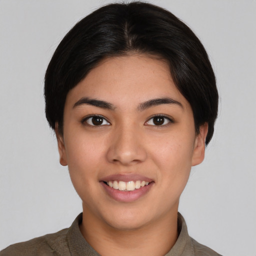 Joyful white young-adult female with short  black hair and brown eyes