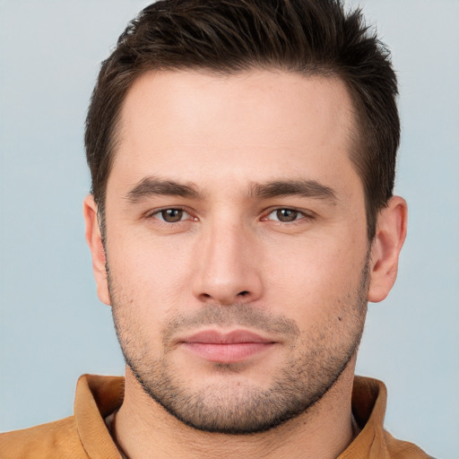 Joyful white young-adult male with short  brown hair and brown eyes