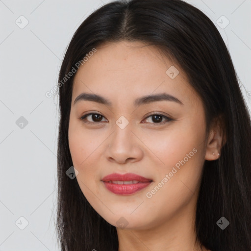 Joyful asian young-adult female with long  brown hair and brown eyes