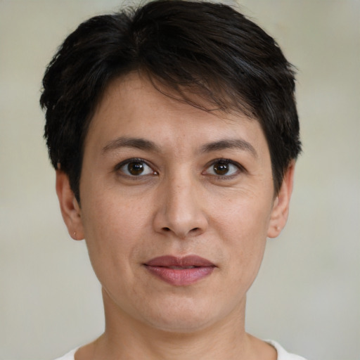 Joyful white adult female with short  brown hair and brown eyes