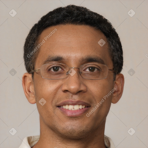 Joyful black young-adult male with short  brown hair and brown eyes