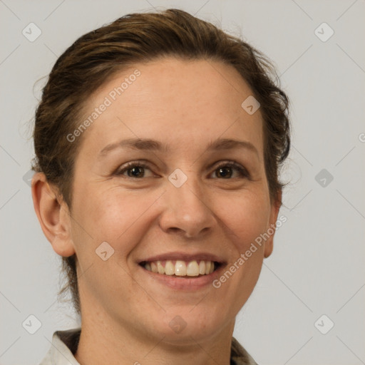 Joyful white adult female with short  brown hair and brown eyes