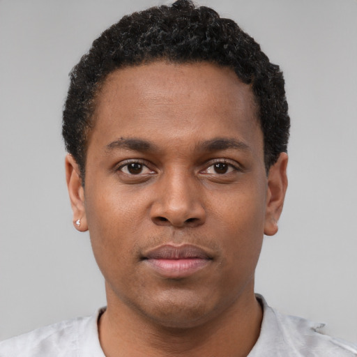 Neutral latino young-adult male with short  brown hair and brown eyes