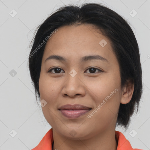 Joyful asian young-adult female with medium  brown hair and brown eyes