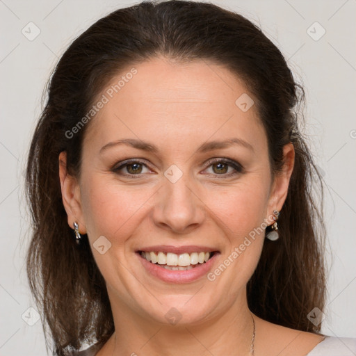 Joyful white adult female with medium  brown hair and grey eyes