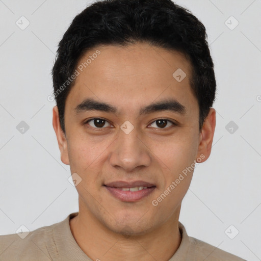 Joyful latino young-adult male with short  black hair and brown eyes