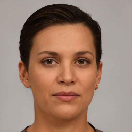 Joyful white young-adult female with short  brown hair and brown eyes