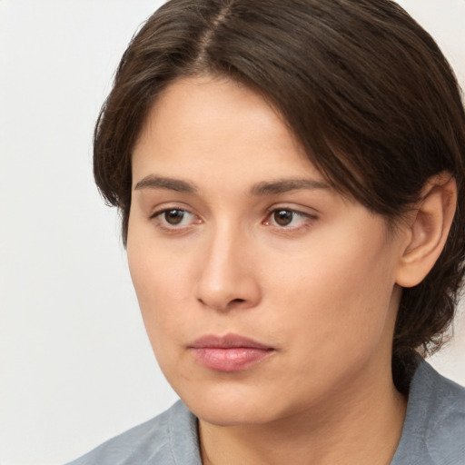 Neutral white young-adult female with medium  brown hair and brown eyes