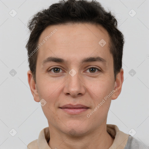 Joyful white adult male with short  brown hair and brown eyes