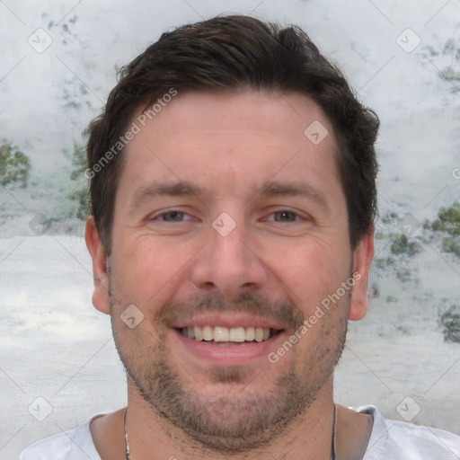 Joyful white adult male with short  brown hair and brown eyes