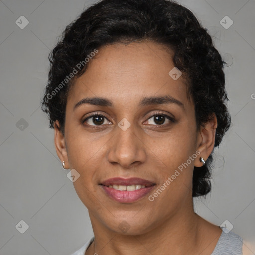 Joyful latino young-adult female with short  brown hair and brown eyes