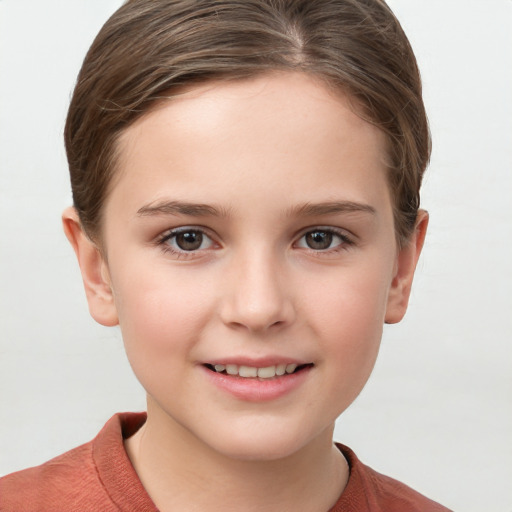 Joyful white child female with short  brown hair and grey eyes