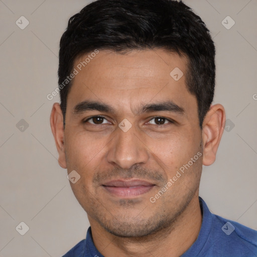 Joyful white young-adult male with short  black hair and brown eyes