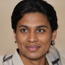 Joyful latino young-adult male with short  brown hair and brown eyes