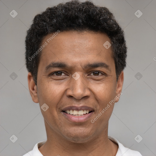 Joyful white adult male with short  black hair and brown eyes