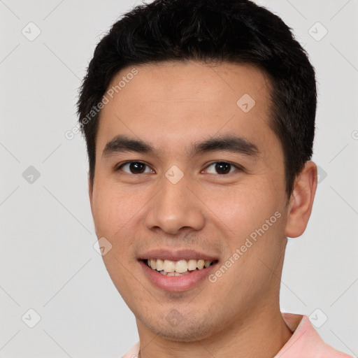 Joyful white young-adult male with short  black hair and brown eyes