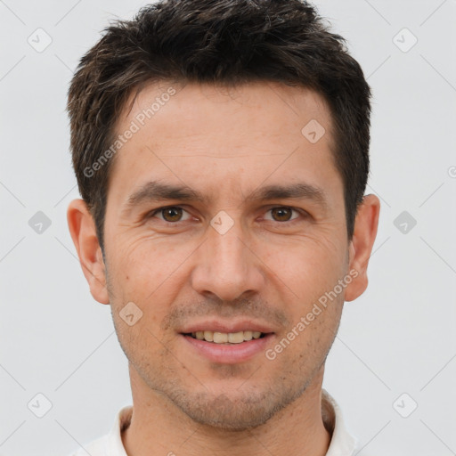 Joyful white adult male with short  brown hair and brown eyes