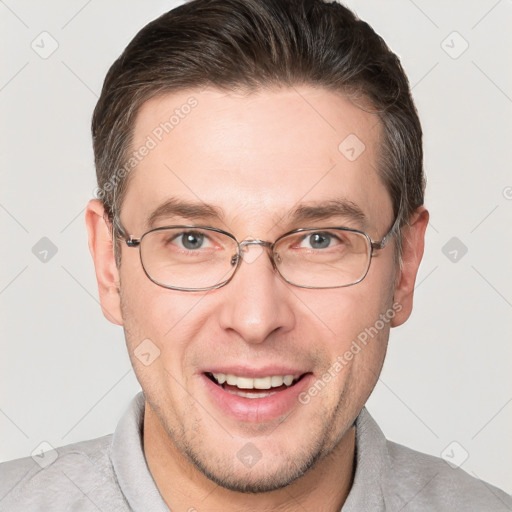 Joyful white adult male with short  brown hair and brown eyes