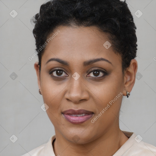 Joyful black young-adult female with short  brown hair and brown eyes