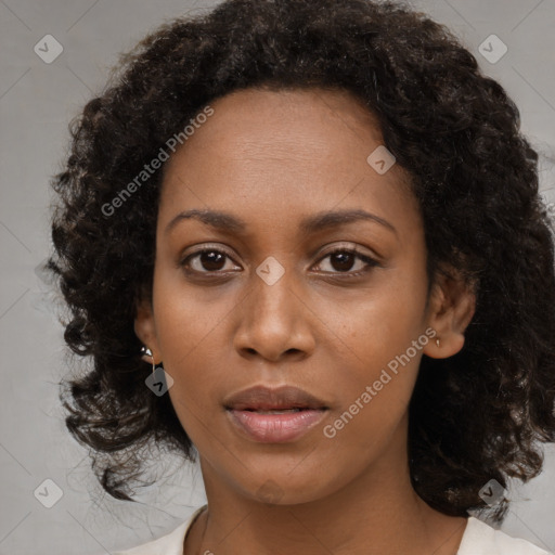 Neutral black young-adult female with medium  black hair and brown eyes