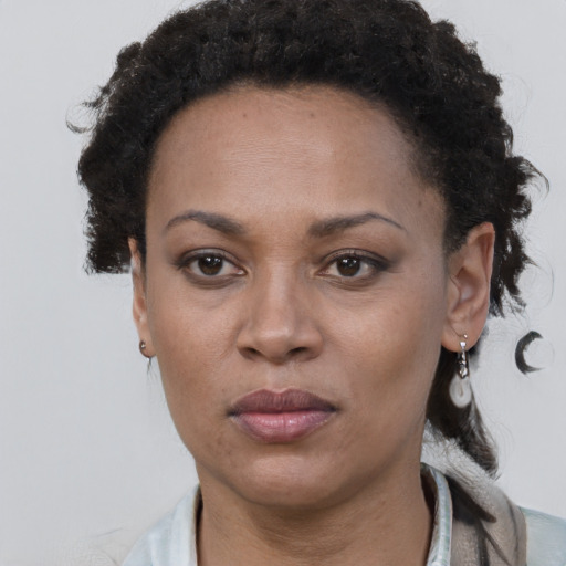 Neutral black adult female with short  brown hair and brown eyes