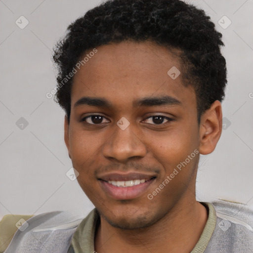 Joyful black young-adult male with short  brown hair and brown eyes