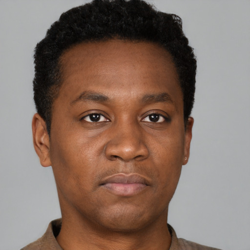Neutral black young-adult male with short  brown hair and brown eyes