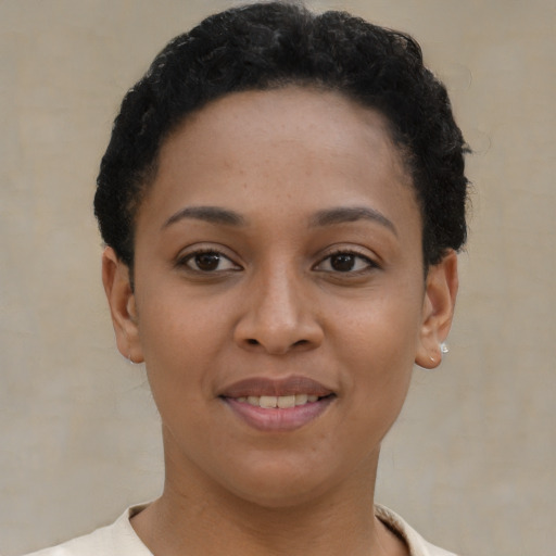 Joyful latino young-adult female with short  brown hair and brown eyes