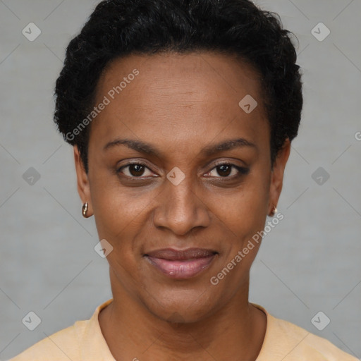 Joyful black young-adult female with short  black hair and brown eyes